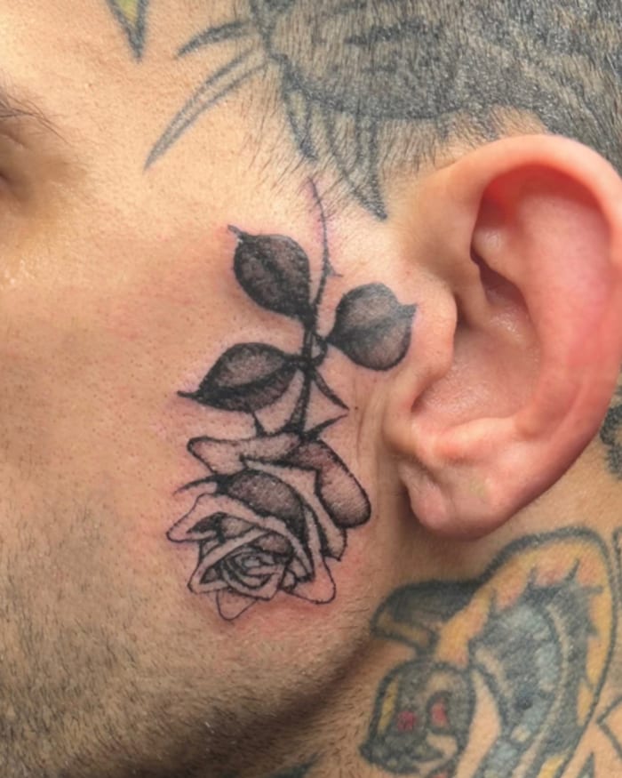 Fine line rose, behind the ear