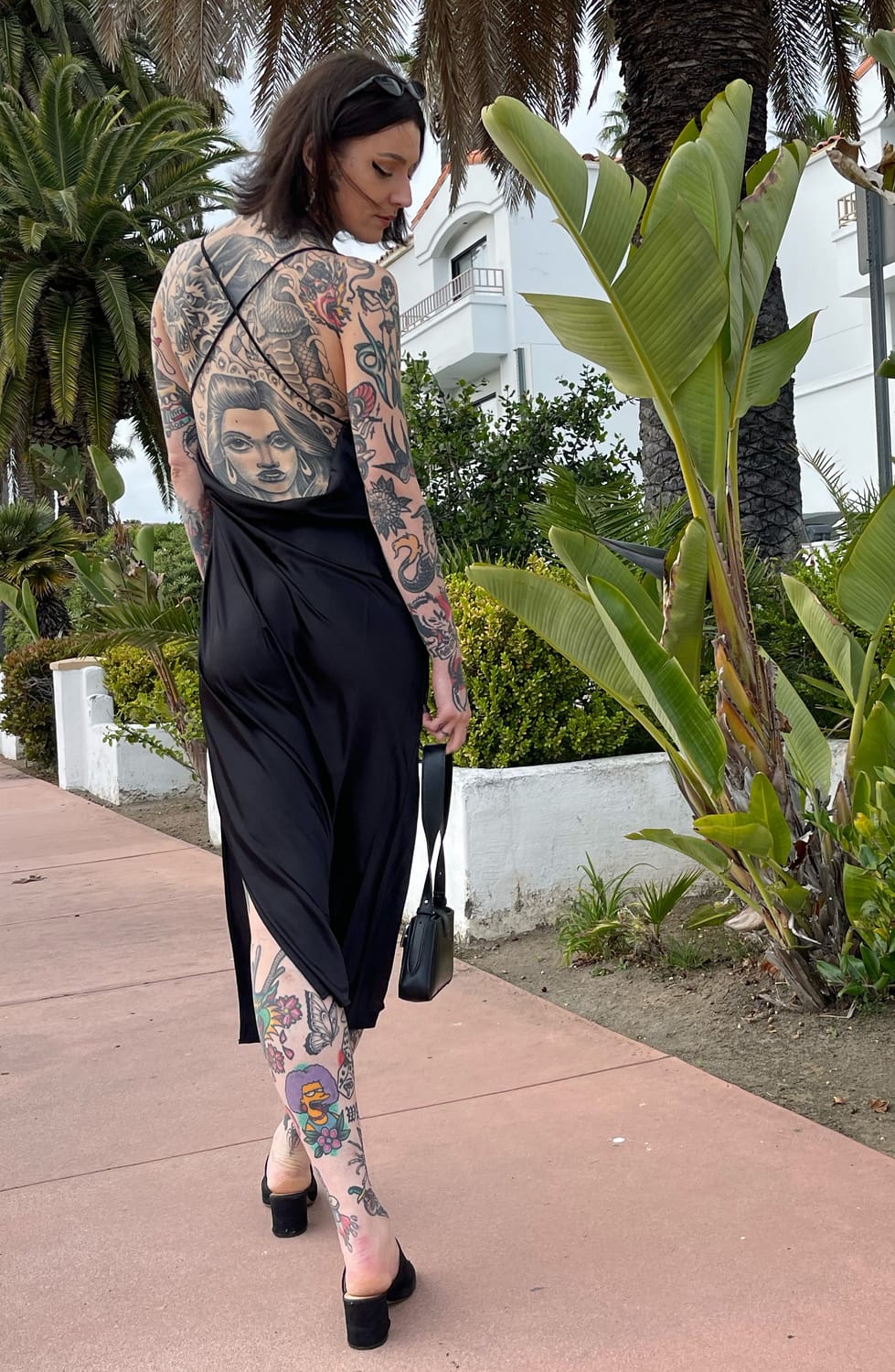 Natasha Smith, showing her own back and leg tattoos